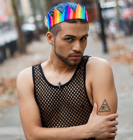 Spanish guy wearing gay pride rainbow crown
