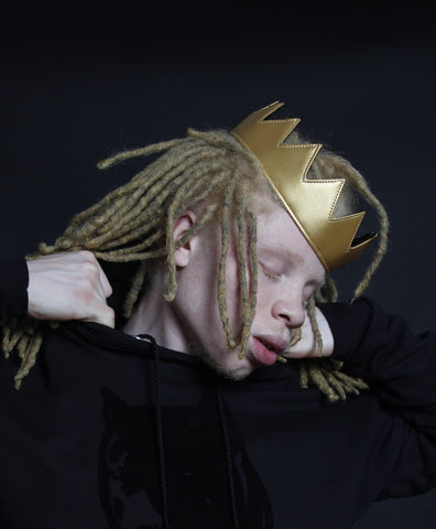 man wearing gold leather crown
